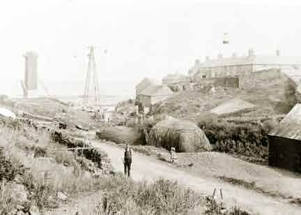 Picture of Craster, Houses and Harbour Cranes