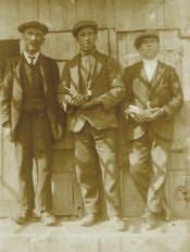 Hadston, Crackett family men at their pigeon loft - Click for bigger image